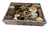 Box filled with various natural bird toys including vine, sola, loofah, palm