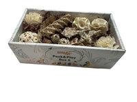 Box filled with various natural bird toys including vine, sola, loofah, palm