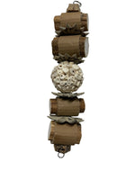 Bird toy made of natural materials including sola, palm leaf and sunflower slices